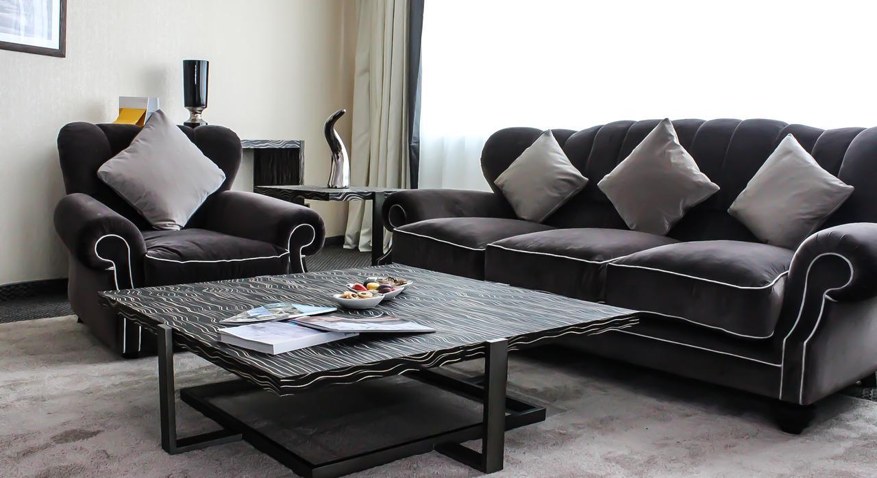 Grand Mogador City Center Касабланка Экстерьер фото A living room